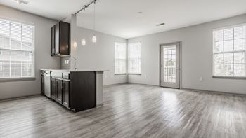 A spacious kitchen with plank floors